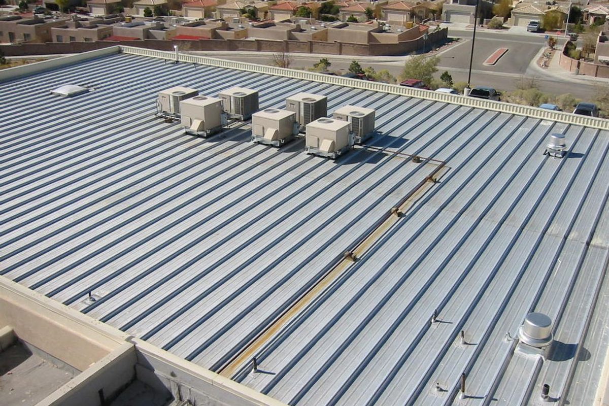 Believers Center roof with rooftop units, 55,000 square feet of spray foam over metal deck and built-up roof