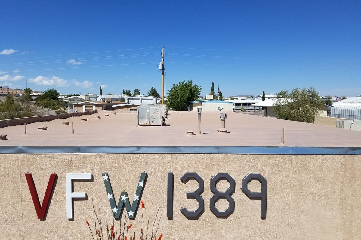 VFW Post 1389 in Elephant Butte with its new spray foam roof visible above the sign wall